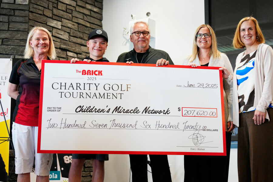 Cheque presentation with Stollery Champion Children, Darci, and Adam Starkman.