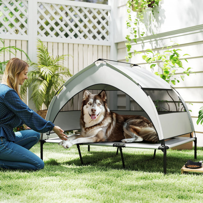 PawHut Elevated Dog Bed, Raised Outdoor Dog Cot with Removable Canopy, Breathable Mesh, Storage Bag, Portable Pet Cot for Indoor Outdoor Large Breeds, 48\" x 36\" x 37\", Light grey