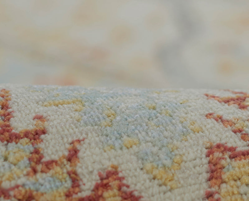 Esme Traditional 6'7\" x 9'6\" Area Rug in Ivory Indoor Area Rug