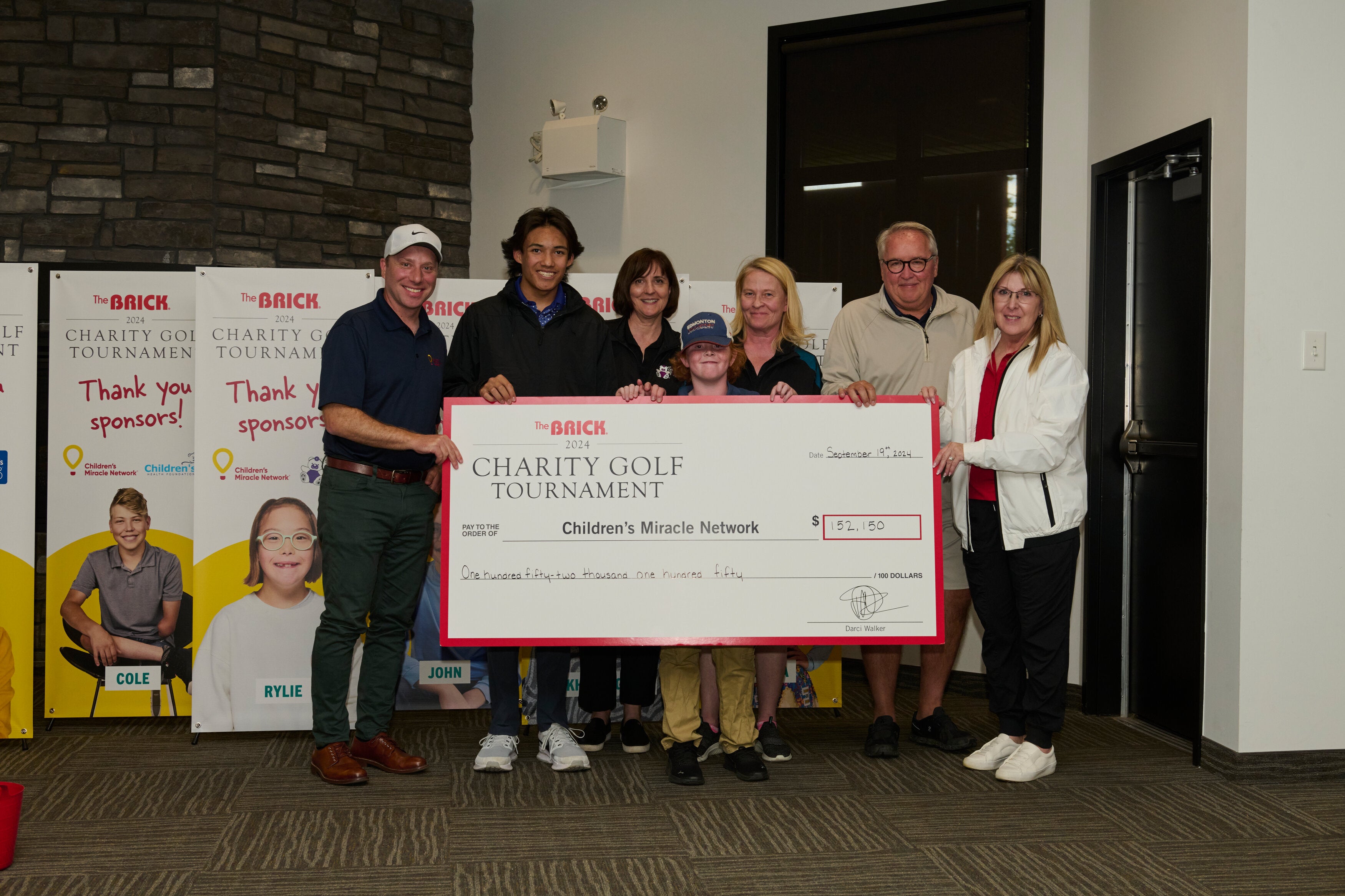 Cheque presentation with Stollery Champion Children, Darci, and Adam Starkman.